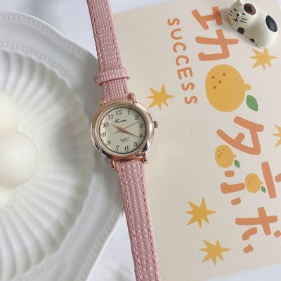 Stiilne ümara kujuga ja ökonahast rihmaga naiste käekell