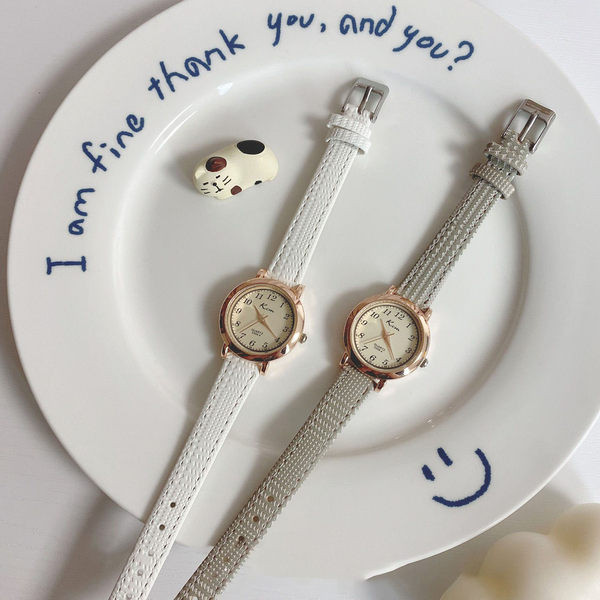 Stiilne ümara kujuga ja ökonahast rihmaga naiste käekell