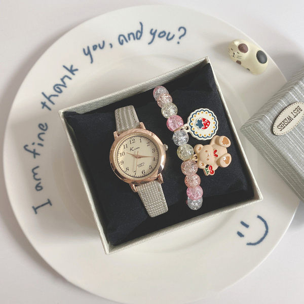 Stiilne ümara kujuga ja ökonahast rihmaga naiste käekell