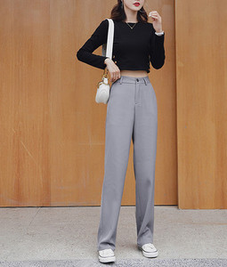 Elegantne hlače s patentnim zatvaračem i gumbima