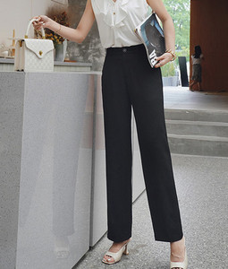 Elegantne hlače s patentnim zatvaračem i gumbima