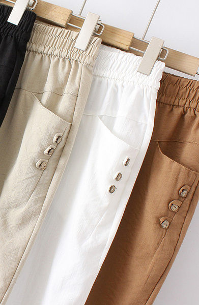 Nyári női nadrág gumírozott derékkal és gombokkal