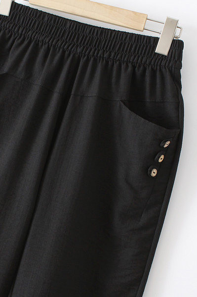 Nyári női nadrág gumírozott derékkal és gombokkal