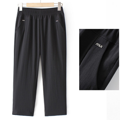 Naiste vabaajapükste lai mudel kõrge vöökoha ja taskuga