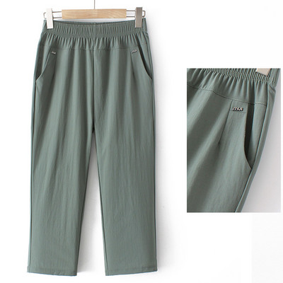 Naiste vabaajapükste lai mudel kõrge vöökoha ja taskuga