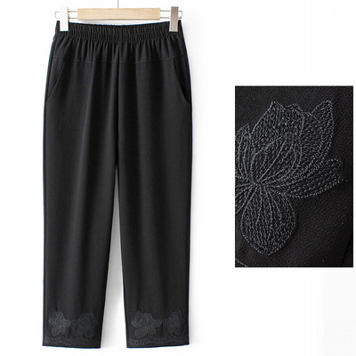 Stiilsed naiste püksid tikandite ja taskutega