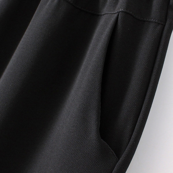 Stiilsed naiste püksid tikandite ja taskutega