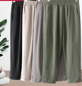 Naiste laia säärega püksid kõrge vöökoha ja nööpidega säärtes