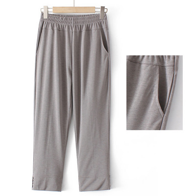 Naiste laia säärega püksid kõrge vöökoha ja nööpidega säärtes