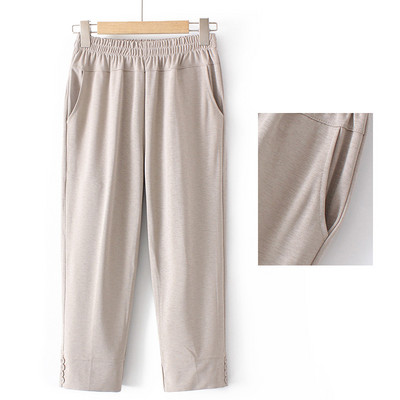 Naiste laia säärega püksid kõrge vöökoha ja nööpidega säärtes