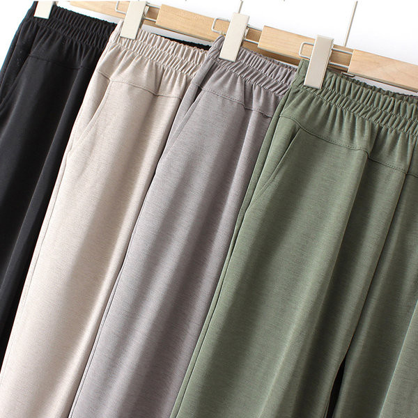 Naiste laia säärega püksid kõrge vöökoha ja nööpidega säärtes