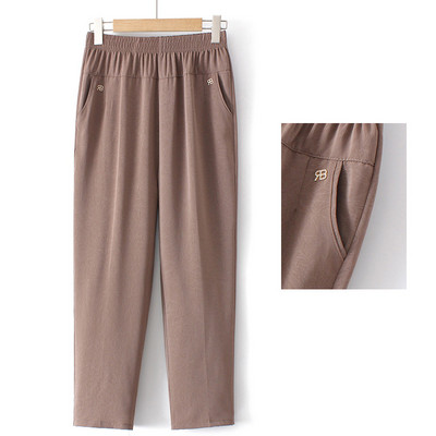 Pantaloni eleganti cu talie elastica, buzunare si element metalic