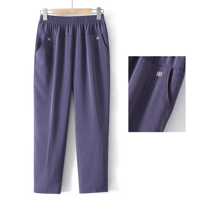 Pantaloni eleganti cu talie elastica, buzunare si element metalic