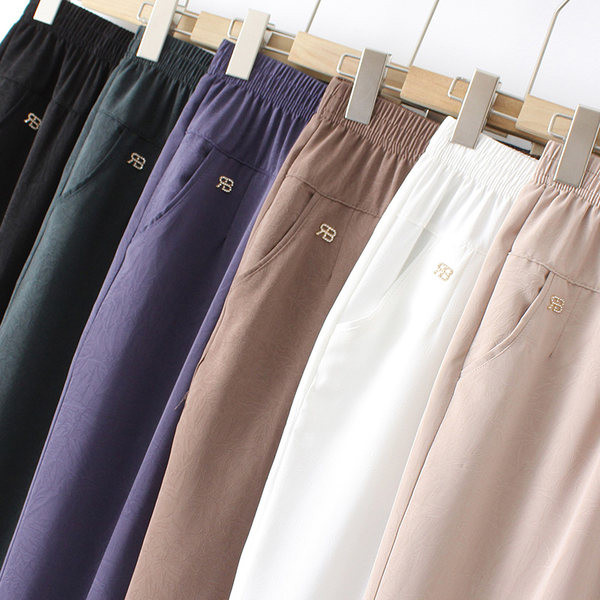 Pantaloni eleganti cu talie elastica, buzunare si element metalic