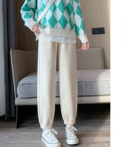 Naiste vabaaja triibulised rasedapüksid mustas ja beežis