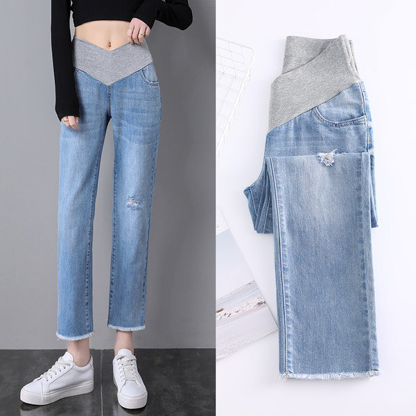 Μοντέρνο σκισμένο τζιν εγκυμοσύνης