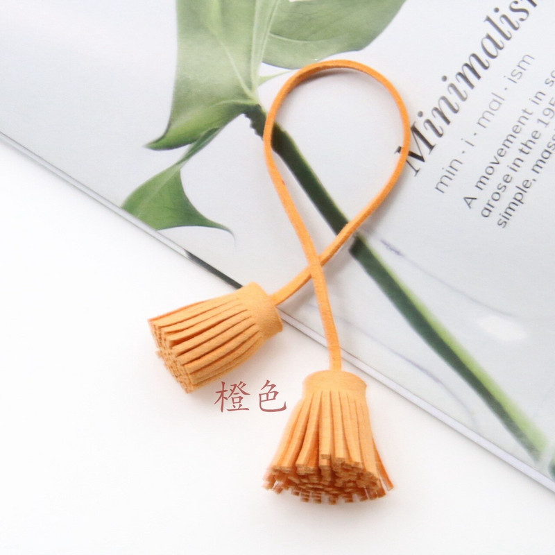 12 tk/partii 3 cm tõmberõngas, kahepealine kunstnahast tutid, narmad, nahast tutid.