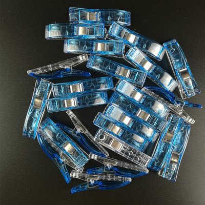 100 vnt. plastikinių audinių segtukai, spaustukai, skirti amatų siuvimui.