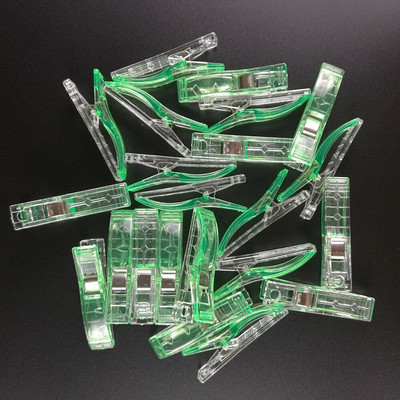 100 vnt. plastikinių audinių segtukai, spaustukai, skirti amatų siuvimui.