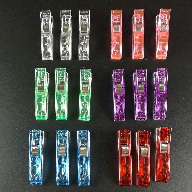 100 vnt. plastikinių audinių segtukai, spaustukai, skirti amatų siuvimui.