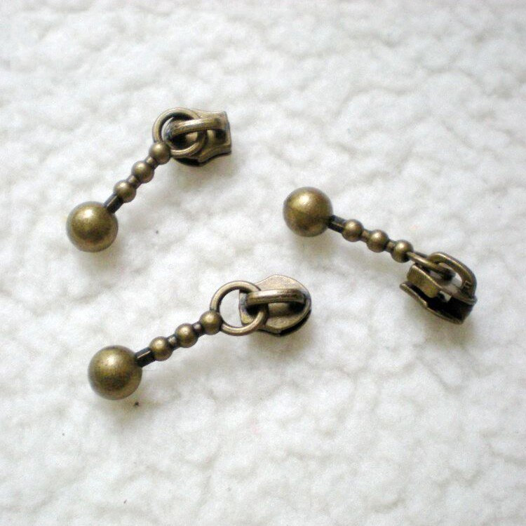 100KOM. Klizači s patentnim zatvaračima Metalni 3# najlonski patentni zatvarači zamjenjuju poteze u obliku kapi Antikni brončani DIY pribor za šivanje