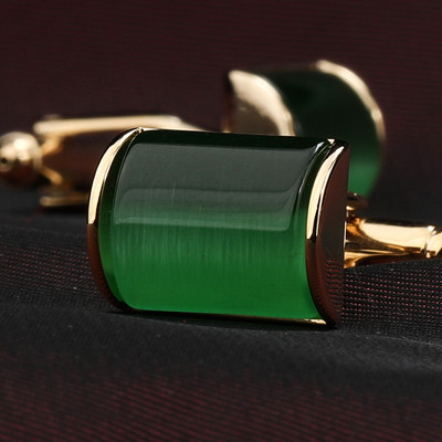 Fashionable men`s cufflinks with colorful decorative stone