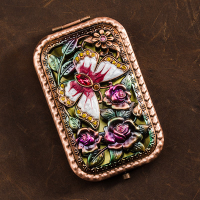 Lillemotiiviga kaasaskantav kosmeetiline peegel