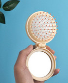 Žensko sklopivo ogledalo s češljem