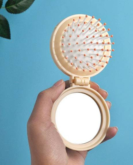 Žensko sklopivo ogledalo s češljem