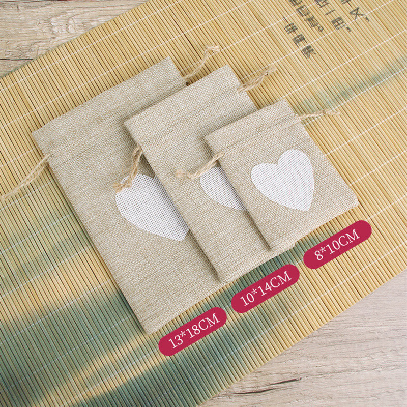 50 tk/partii südametrükk džuudist nööriga kotid 10x14cm ehete väikesed kotikesed pulma jõulukingi pakendi tasku