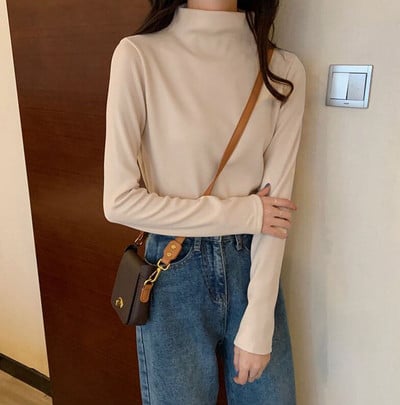 Γυναικεία διάφανη μπλούζα με ψηλό γιακά