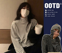 Γυναικεία μπλούζα με ριγέ πόλο γιακά