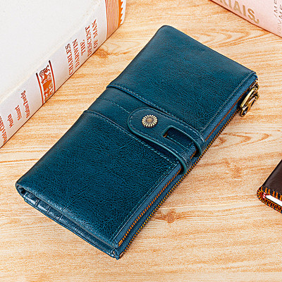 Δερμάτινο ανδρικό πορτοφόλι με δύο θήκες που κλείνει με φερμουάρ και κουμπί