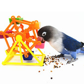 Papagoi toiduotsimise mänguasi värviline pöörlev tuuleveski hammustuse vastane närimisvastane treening toidukarp Lõbus lindude stressi leevendamine harivate mängude tööriist