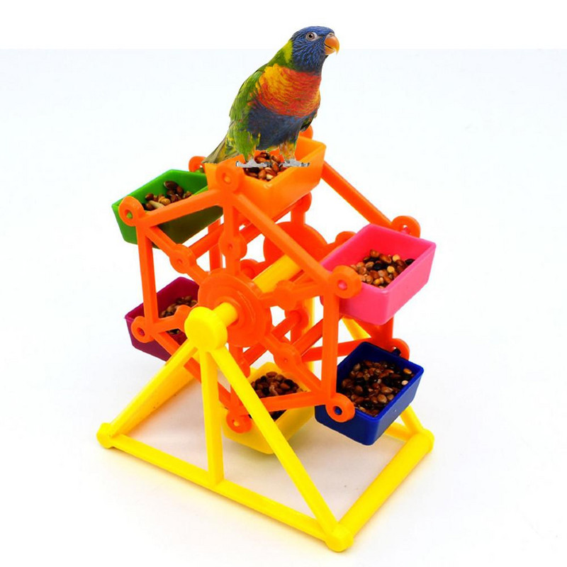 Papagoi toiduotsimise mänguasi värviline pöörlev tuuleveski hammustuse vastane närimisvastane treening toidukarp Lõbus lindude stressi leevendamine harivate mängude tööriist