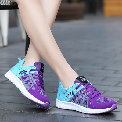 Women`s textile sneakers with lettering and laces