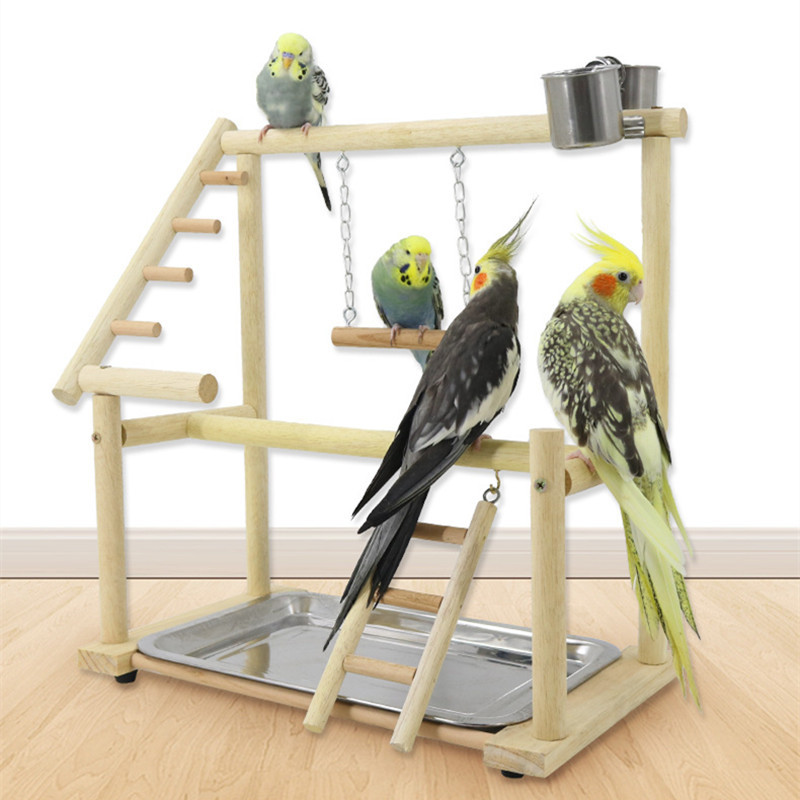 Papagaiļu rotaļu statīvi ar kausu putnu rotaļlietu paplāti putnu šūpoles, kāpšana piekarināmām kāpnēm, tilta koka kaktiņu rotaļu laukums papagaiļu putnu laktas