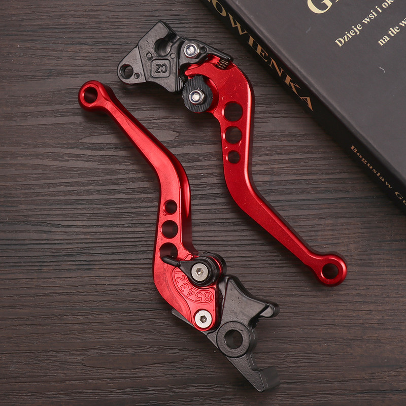 2 gab. Daudzkrāsu sajūga bremžu sviras rokturis Motocikla sajūga bremžu sviras rokturis Augstas kvalitātes piemērots motocikla pārveidošanai