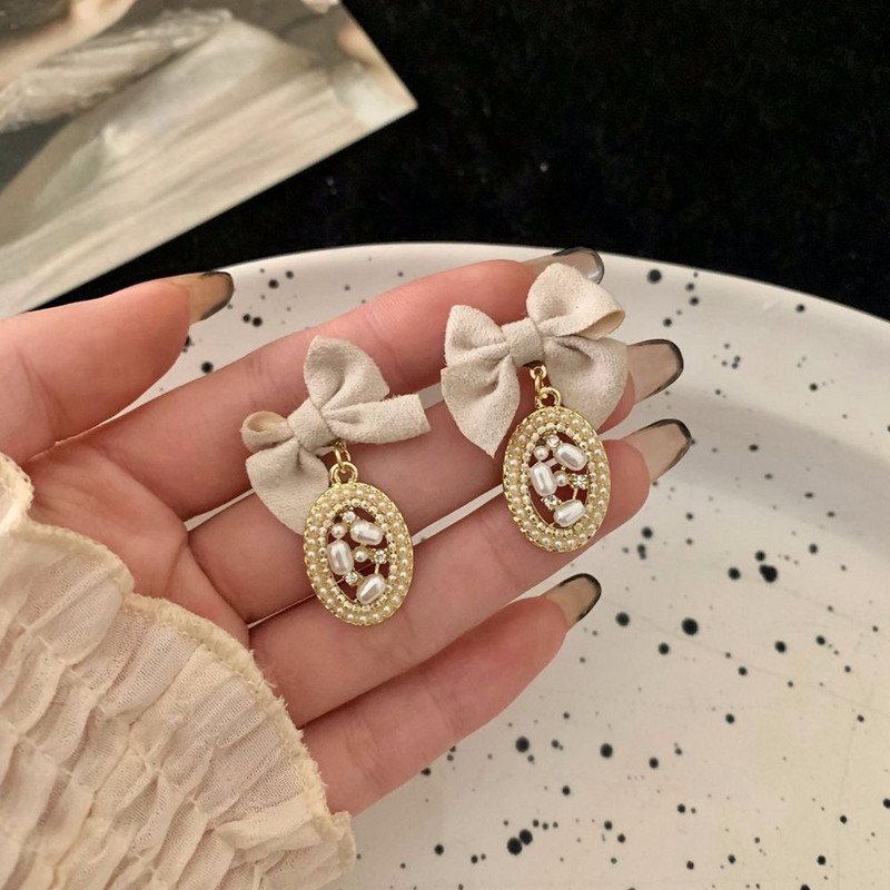 Korejski dizajn Retro slatke naušnice s mašnom od tkanine Ženski elegantni ovalni biserni metalni privjesak Viseća naušnica Temperamentni modni nakit