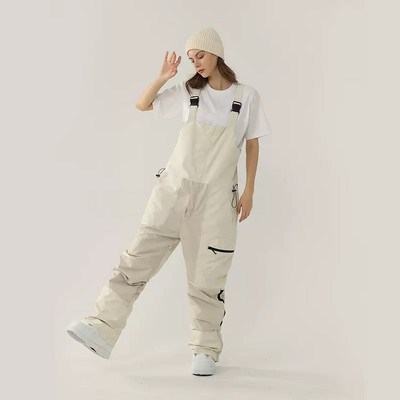 Nauji vientisos slidinėjimo kelnės kombinezonai, atsparūs vėjui, moteriški lauko kostiumai snieglenčių sportui Vyriški kombinezonai, atsparūs vandeniui slidinėjimo kostiumai, laisvi sniego drabužiai