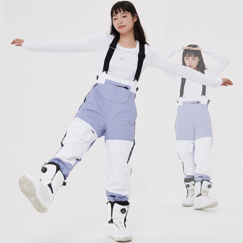 Moteriškos slidinėjimo kelnės Naujos profesionalios pakabinamos, vandeniui atsparios, vėjui atsparios snieglenčių kelnės, laisvos violetinės vientisos kelnės