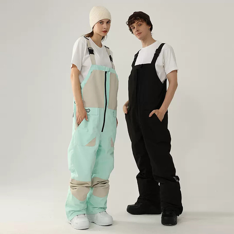 Нов ски гащеризон Дамски мъжки ски панталони от една част Спорт на открито Сноуборд костюм Гащеризон Ветроустойчив водоустойчив снежен костюм Облекло