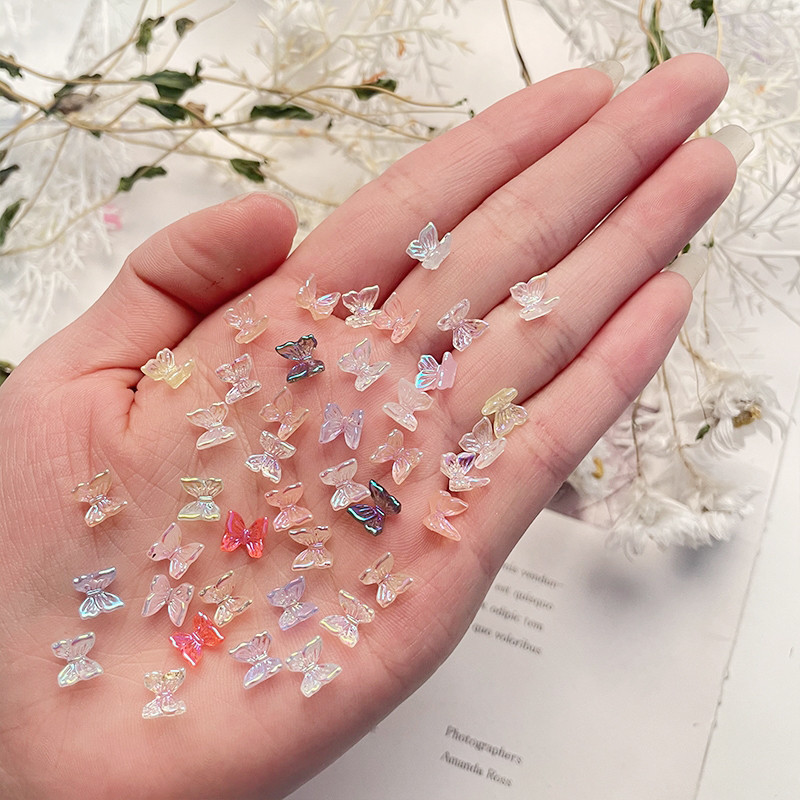 30/100 db Nail Art Kiegészítők Gyanta pillangó Aurora Smart Color Holografikus divat 3D köröm barkács dekoráció