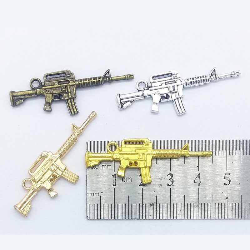 10 tk püstolkuulipilduja kujuga küünevõlu kaunistus 3D püstolisulamist küünte maniküüri tarvikud