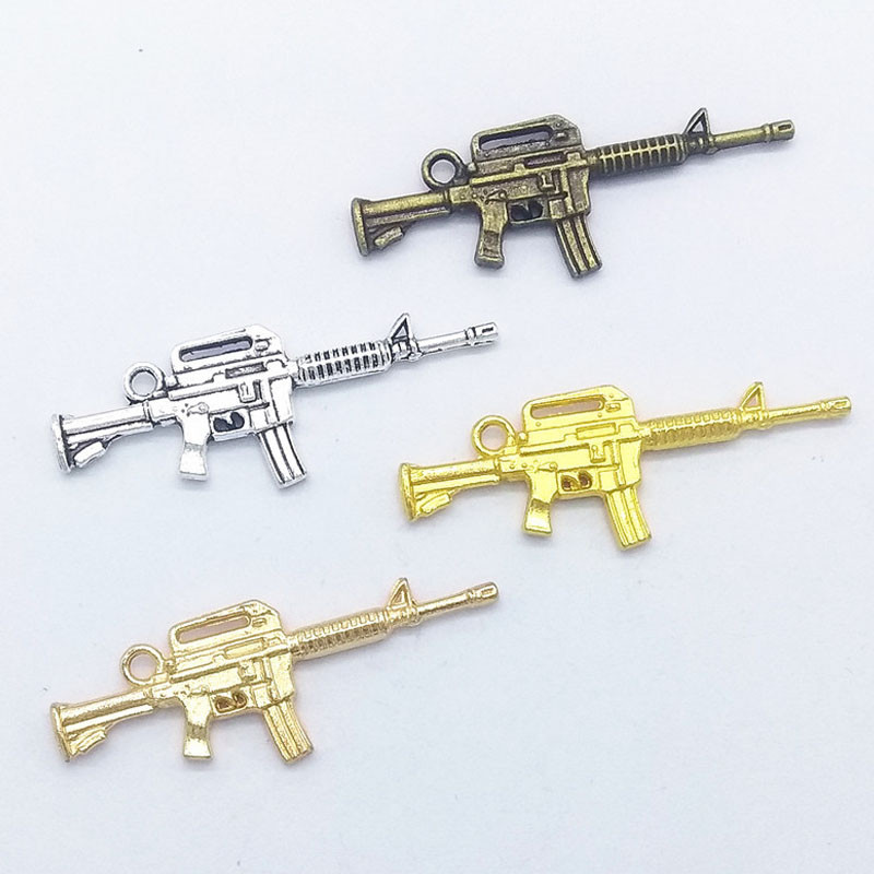 10 tk püstolkuulipilduja kujuga küünevõlu kaunistus 3D püstolisulamist küünte maniküüri tarvikud