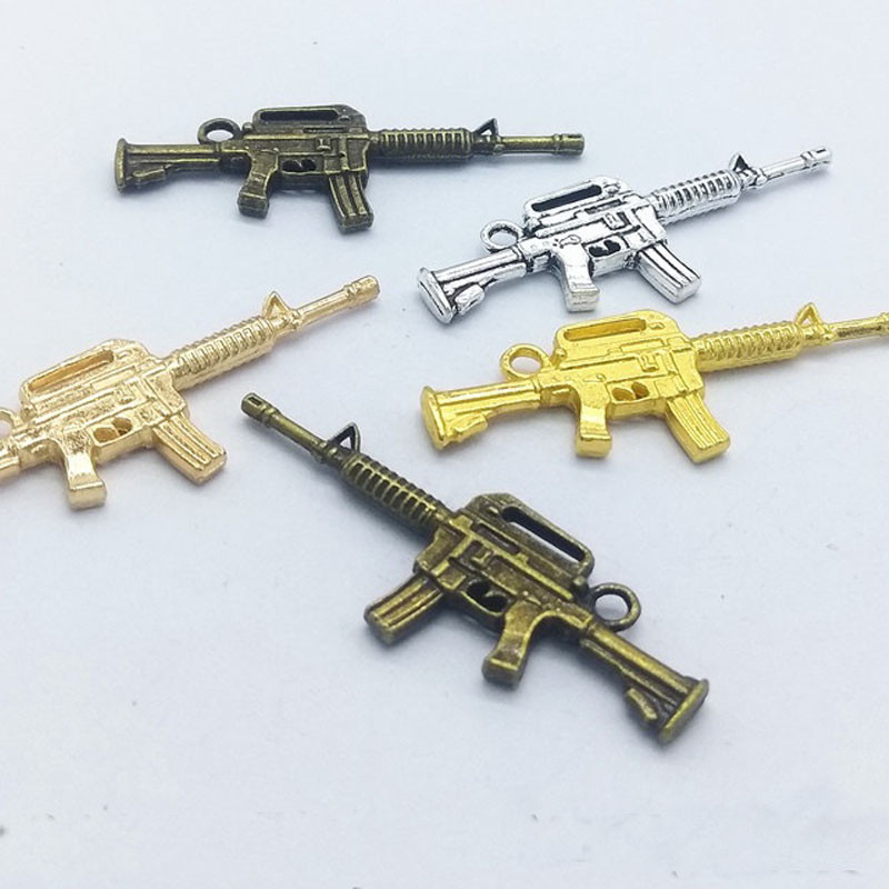 10 tk püstolkuulipilduja kujuga küünevõlu kaunistus 3D püstolisulamist küünte maniküüri tarvikud