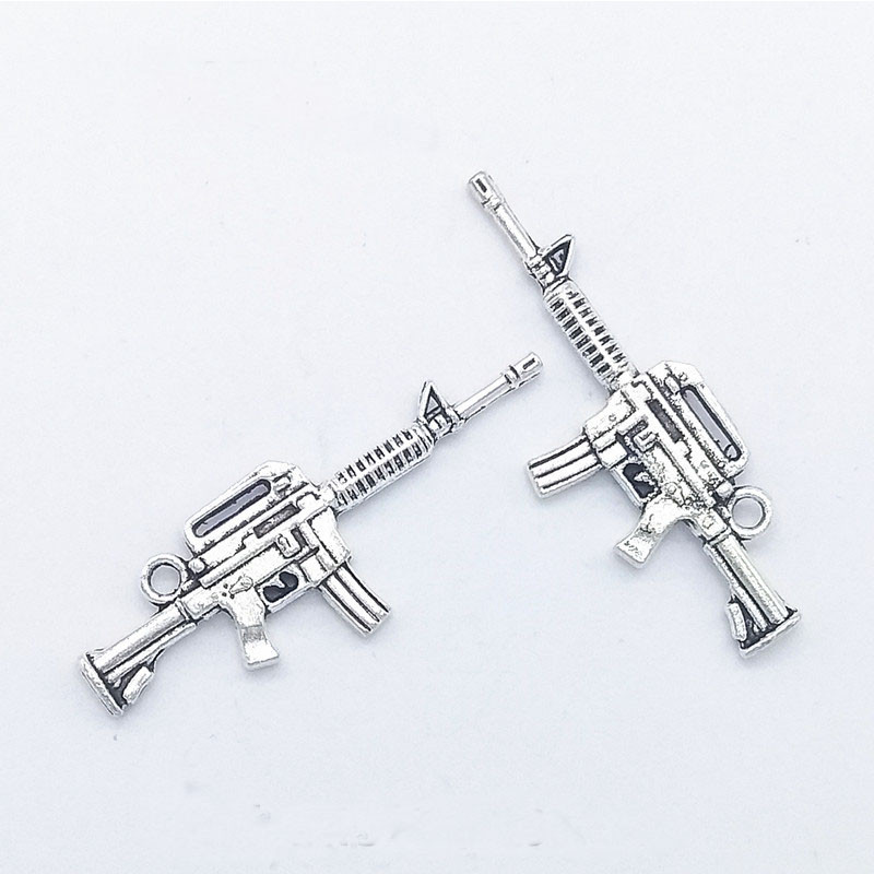 10 tk püstolkuulipilduja kujuga küünevõlu kaunistus 3D püstolisulamist küünte maniküüri tarvikud