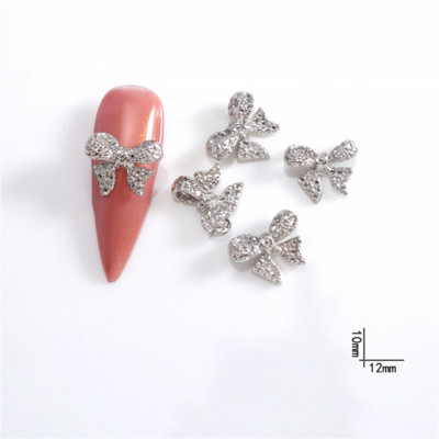 20db Ötvözet masni pillangó körömbűvölők arany ezüst csillogó fém masni csomó körmök dekor alkatrészek 3D strassz manikűr kiegészítők