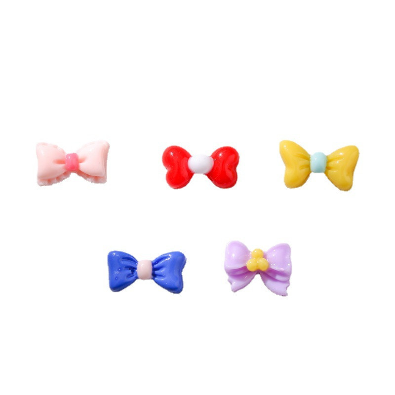 50 db Kis masni csomó Körmök Alkatrészek Bájok Ékszer Macaron Fényes Csokornyakkendő Aranyos Mini Rajzfilm All-Match Nails Art Dekoráció 5,3*9,3mm