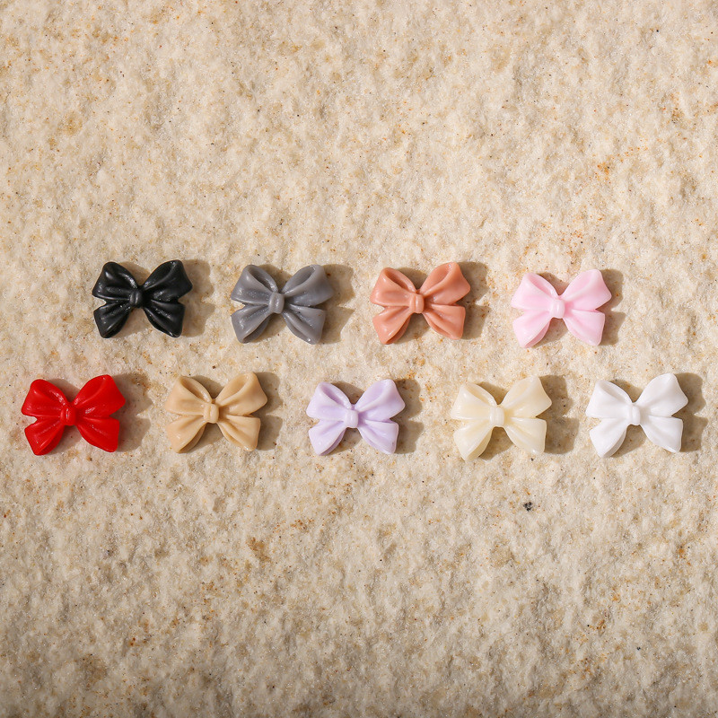 50db Kawaii Bow Resin Nail Art Charm 3D Bowknot Nyári Aranyos Dísz Ékszer Craft Csokornyakkendő Dekorációs Alkatrészek Manikűr 8,5*12,5mm